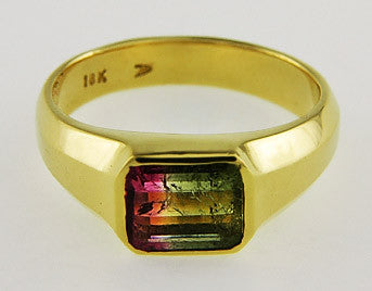 Pink green two tone tourmaline yellow gold ring.