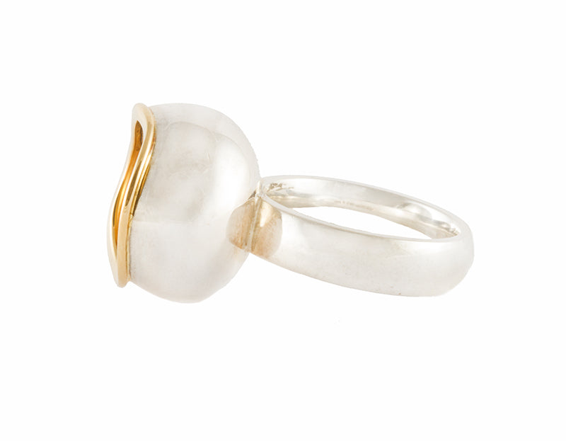 Very large silver ring, large bowl, gold rimmed pearl set inside.