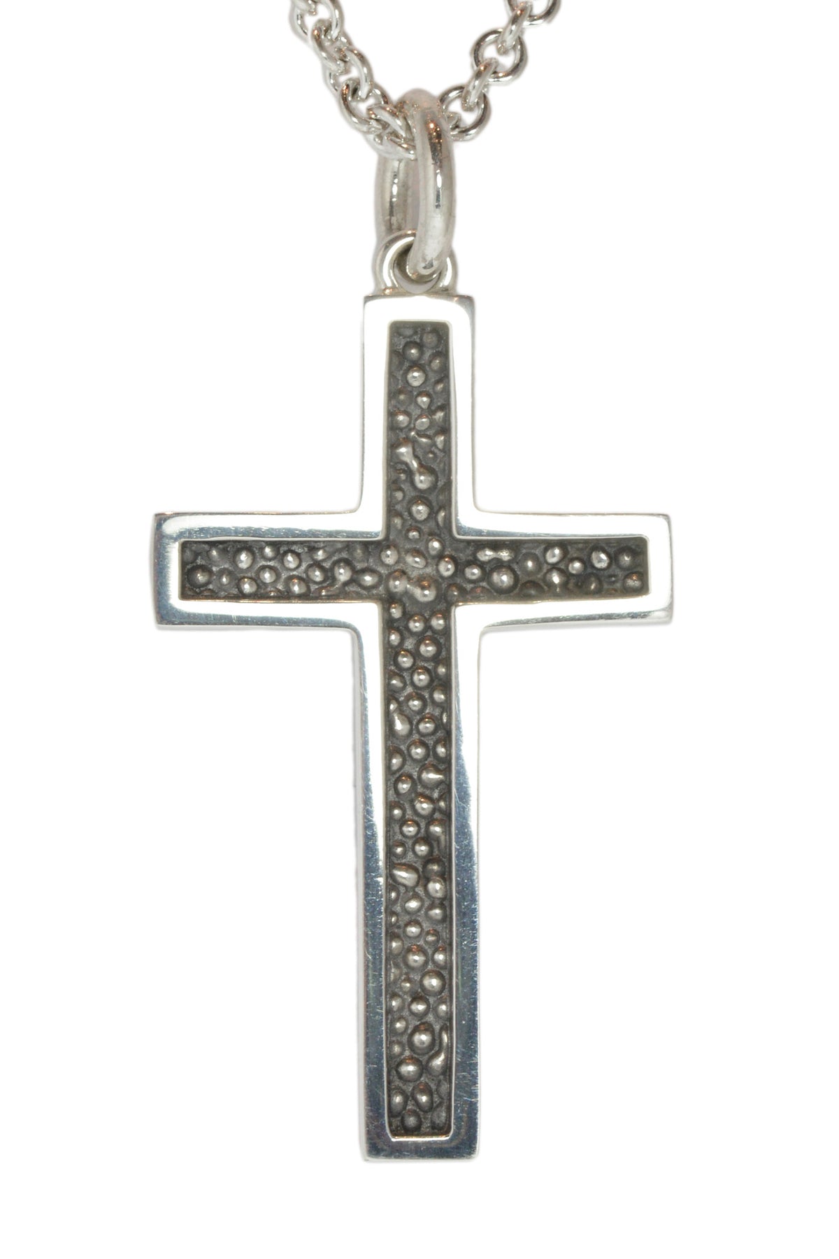 Very large silver cross pendant, blackened.  Hung on silver chain.
