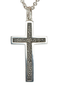 Very large silver cross pendant, blackened.  Hung on silver chain.