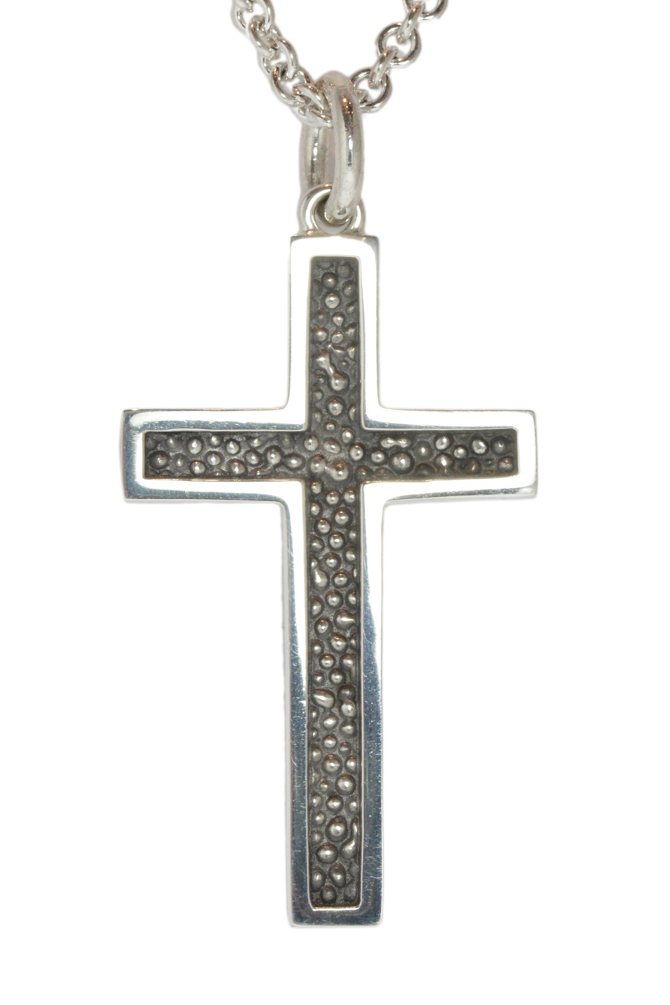 Very large silver cross pendant, blackened.  Hung on silver chain.