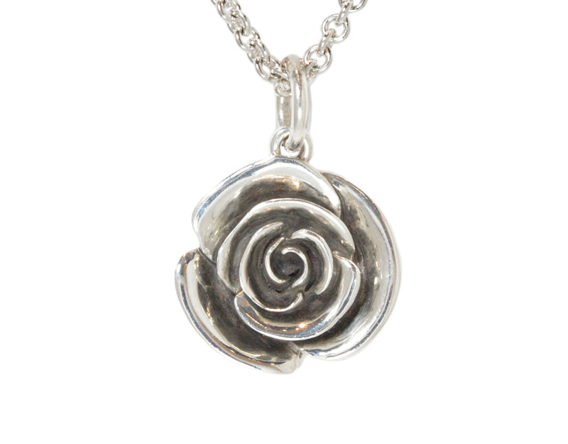 Very large silver carved rose pendant, blackened.  Hung on silver chain.
