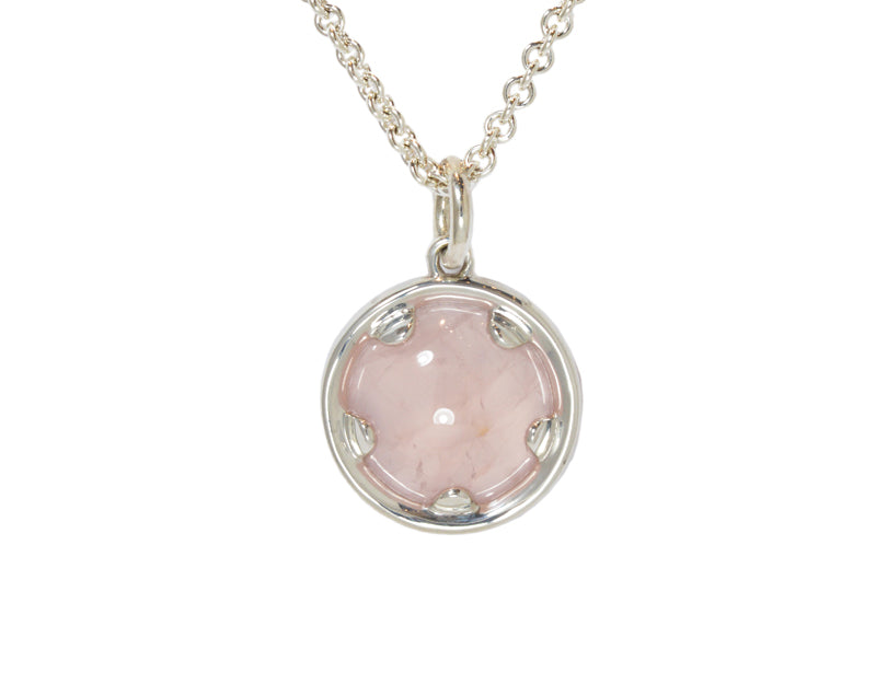Very large silver pendant with pink quartz.  Hung on silver chain.