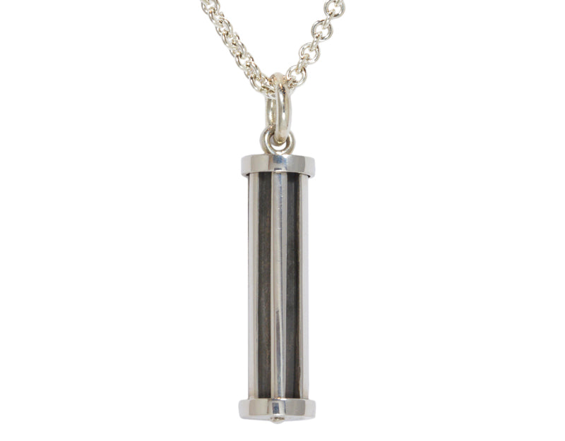Very large tubular silver pendant with blackening.  Hung on silver chain.