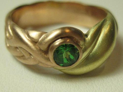 Rose and green gold band, leaf motif, set with green tsavorite garnet.