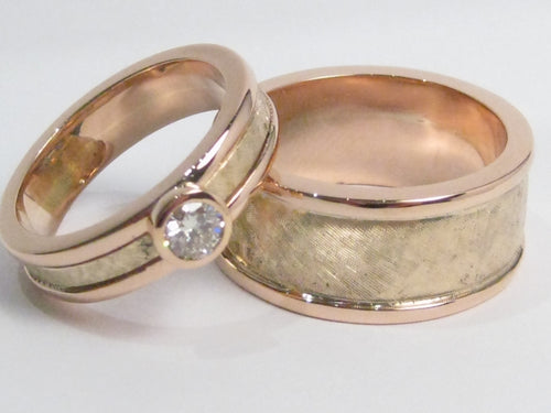 Green and rose gold bands with texture, one with diamond.