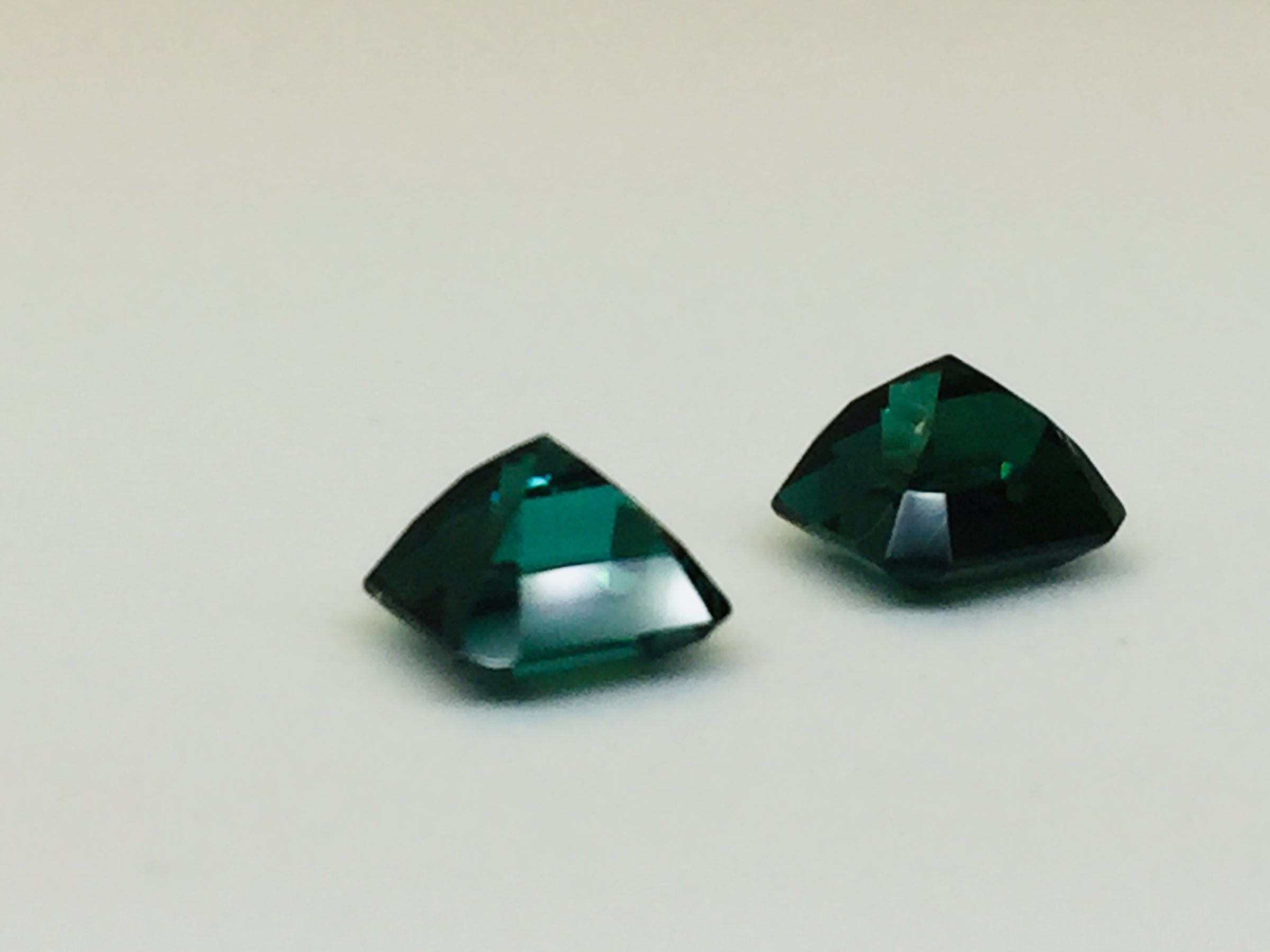 Indicolite tourmaline against white background.