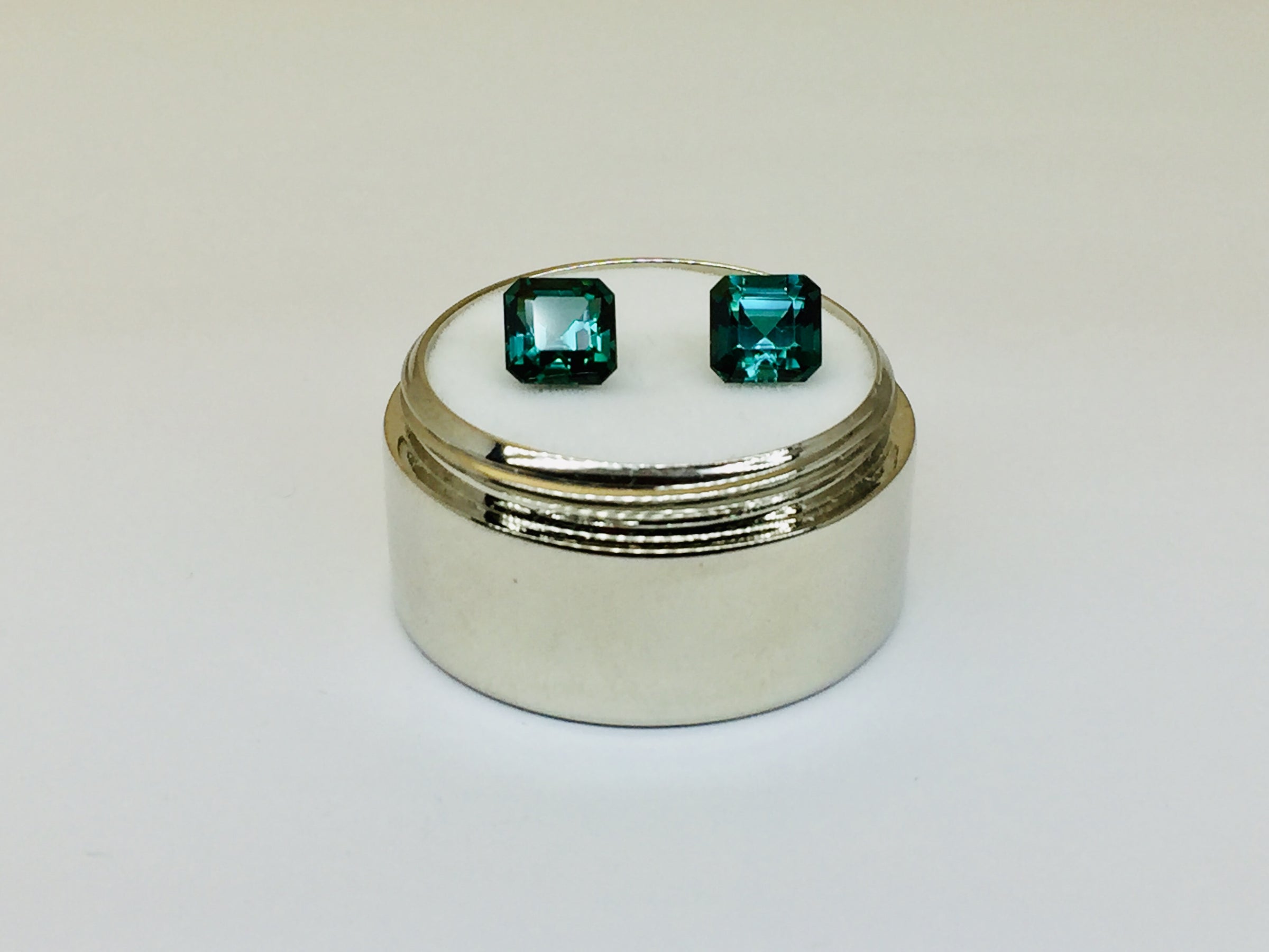 Indicolite tourmaline against white background.