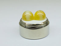 A pair of yellow opal with cat's eye phenomenon.
