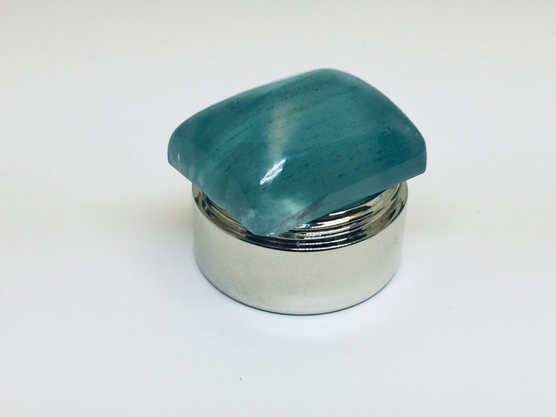 Large aquamarine cabochon.