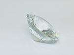 Very large, colourless topaz, white background.