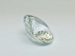 Very large, colourless topaz, white background.