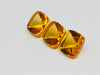 Three buff top citrine gems, white background.