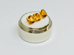 Three buff top citrine gems, white background.