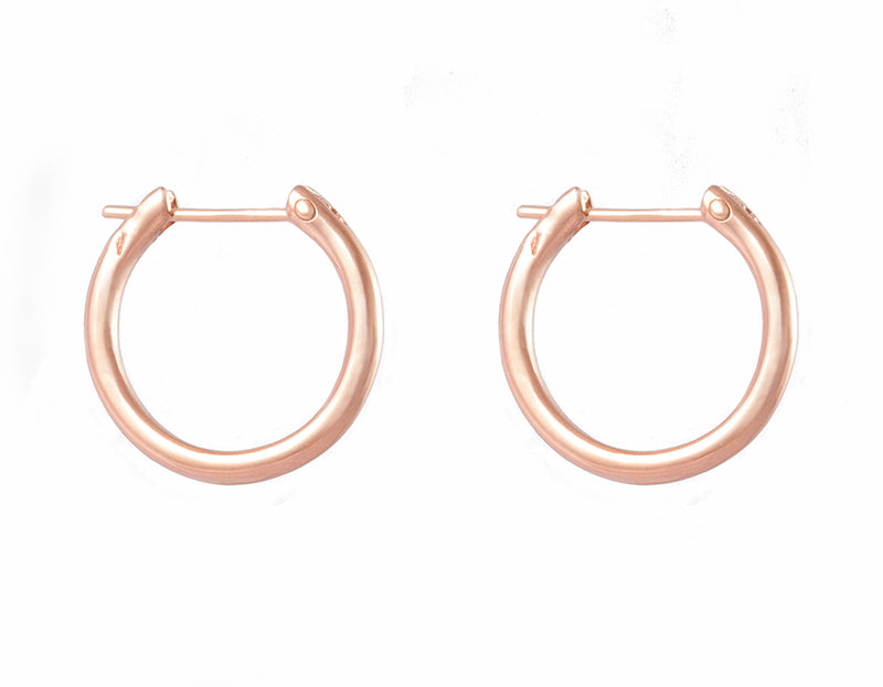 Solid 18 karat rose gold hoops.