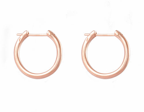 Solid 18 karat rose gold hoops.