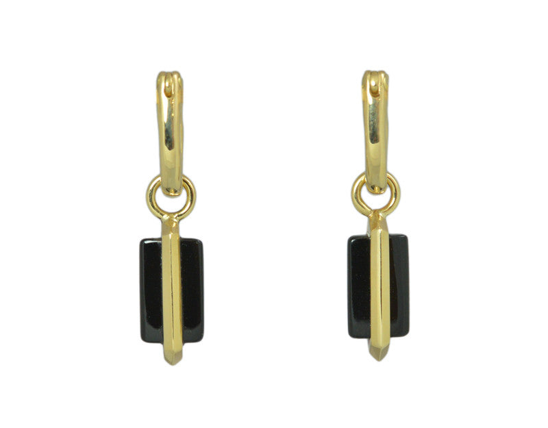 Small wafers of black onyx with gold frame through centre. Drops hang from small U shaped hoops in yellow gold.
