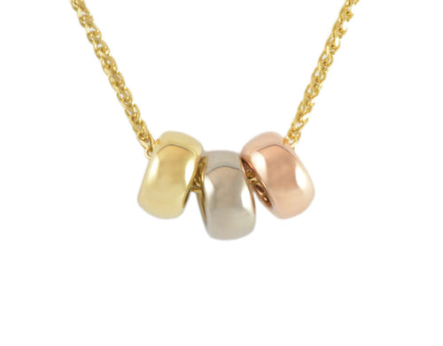 Three donut-shaped beads in rose, white and yellow gold on chain.