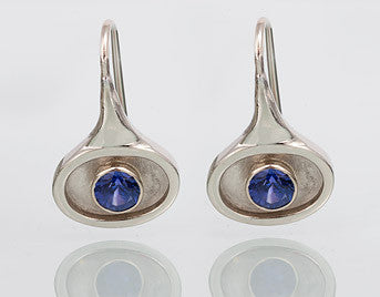Oval earrings in white gold set with round purple blue tanzanites