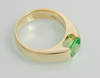 Green Tsavorite garnet ring in green gold.