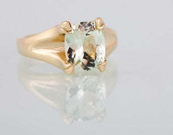 Yellow gold ring heavy prongs set with pastel green Chrysoberyl gem.