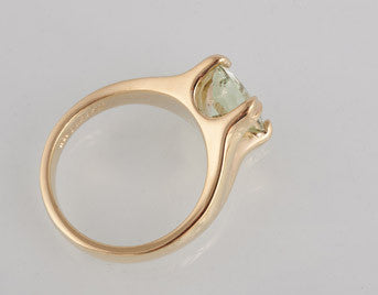 Yellow gold ring heavy prongs set with pastel green Chrysoberyl gem.