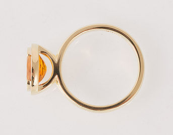 Yellow gold ring with oval bright orange citrine gem.