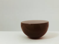 Very large round mocha coloured moonstone cabochon gem, white background.