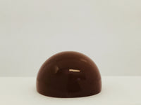 Very large round mocha coloured moonstone cabochon gem, white background.