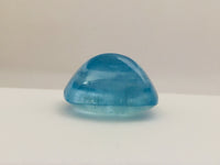 Large rectangle rich light blue aquamarine gem, white background.