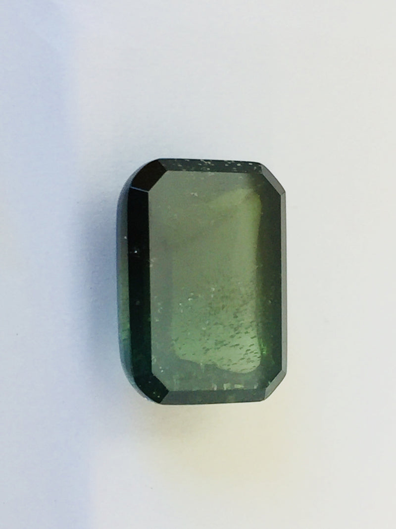 Large rectangle green zircon cabochon gem, white background.