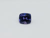 Deep purple coloured sapphire gem, white background.