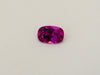 Small rectangle vivid pink sapphire gem, white background.