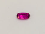 Small rectangle vivid pink sapphire gem, white background.