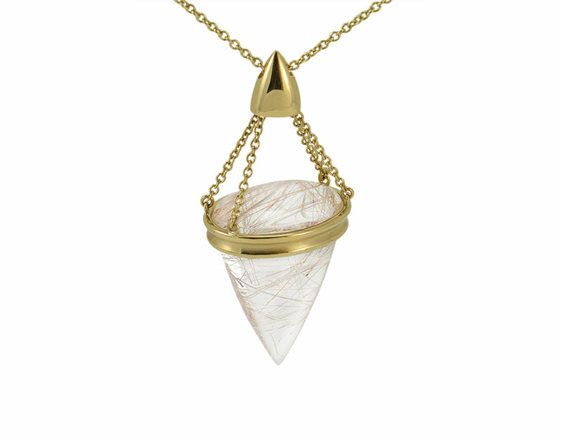 Very large pendant in yellow gold with large clear gem with golden needles inside. On gold chain.