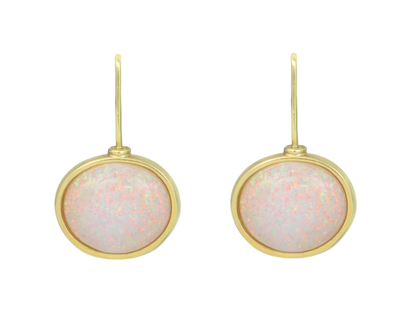 Oval white opal gems with multi-coloured flashes set with green gold rims and shepherd's hooks.