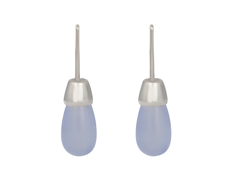 Blue pear shaped gem earrings with white gold caps and shepherd hooks.