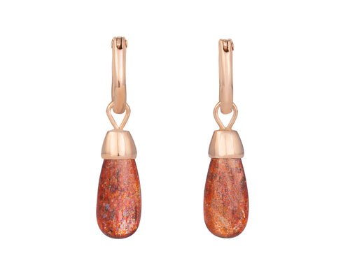 Pendulous bright gems with orange and red specks inside, with rose gold cap. Drops hang from small U shaped hoops in rose gold.