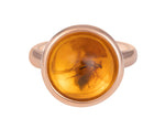 Rose 18 karat gold ring set with round amber with insect inside.