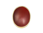 Very very large deep red carnelian oval frame set in green gold ring.