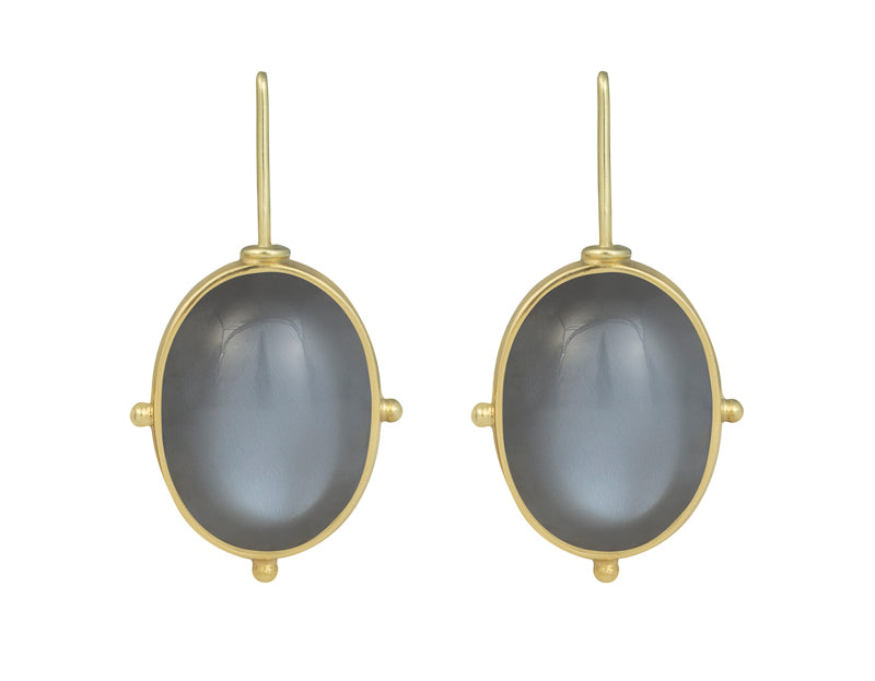 Large oval medium grey moonstone cabochons in green gold frame and shepherd's hooks.