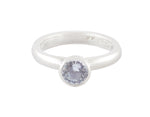 Platinum ring set with round pastel blue sapphire.  The gem is bezel or frame set and sits above the band.