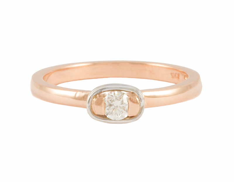 Thin rose gold ring set with a round diamond.  Diamond setting is encircled by platinum wire, looks like it is lashed in.