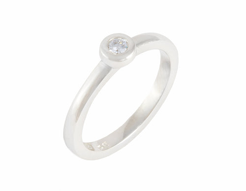 Thin platinum ring set with a round diamond.  The diamond is set in a frame and sits right on top of the band.
