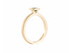 Thin yellow gold ring set with rich medium green tsavorite garnet.  The garnet is square, set in a frame, and sits above the band.