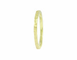 Thin green gold band that has a hammered finish.