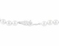 Strand of pale silver blue pearls. Clasp is shaped like bunches of grapes in platinum.