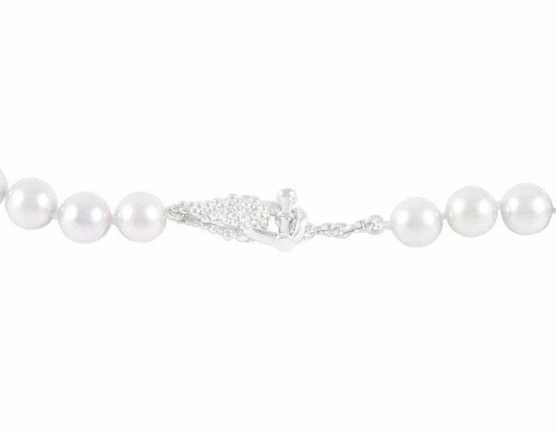Strand of pale silver blue pearls. Clasp is shaped like bunches of grapes in platinum.