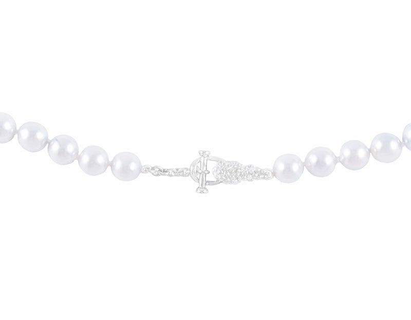 Strand of pale silver blue pearls. Clasp is shaped like bunches of grapes in platinum.