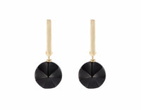 Carved black onyx drops on 18k yellow gold studs.